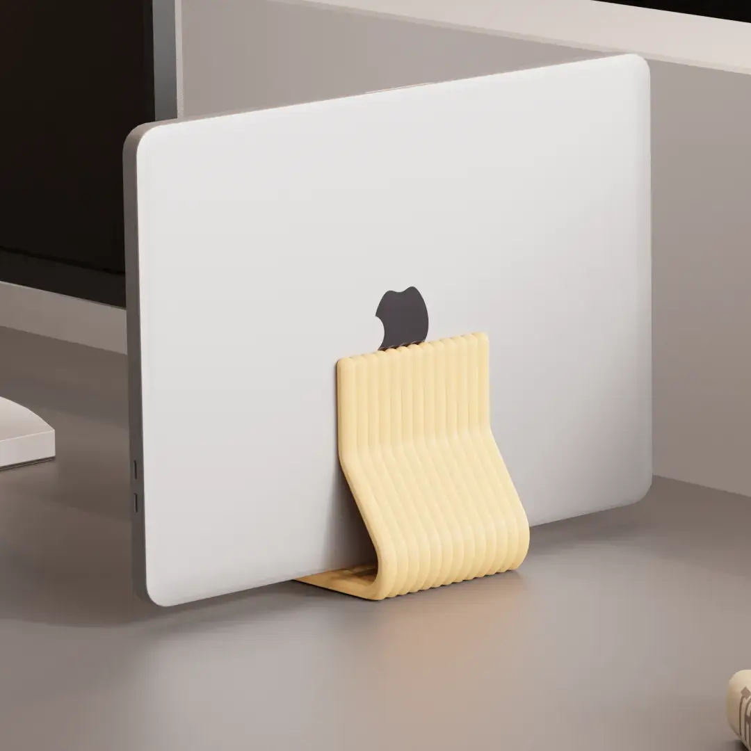 Compact yellow iMac stand holding a MacBook